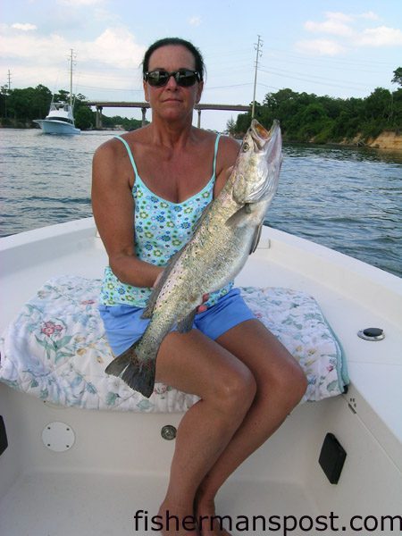 Candace Wooten, from Wilmington, NC, with a 5 lb., 9 oz. citation speckled trout she hooked on a  live pogy in Snow's Cut while fishing aboard the "HyperActive."