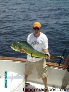 Travis Justice, of Lexington, NC, with his first dolphin. The fish fell for a dead cigar minnow on the light-line while he was anchored up and bottom fishing near Frying Pan Tower with Capts. Butch and Chris Foster aboard the "Yeah Right II."