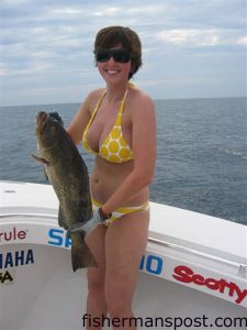 Chelsea Gibbons, from WV, with a keeper gag grouper she hooked on a live pogy at a ledge 25 miles off Bogue Inlet while fishing with Capt. Stan Jarusinski of Capt. Stanman's Fishing Charters.