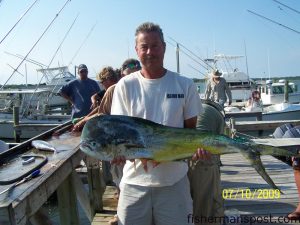 Tim Creech, of Emerald Isle, with a bull dolphin that fell for a live pogy under a sea witch near the SE Bottoms while he was fishing with James Potts on the "Green Dolphin."