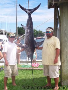 Izzy Mabrey and Ken Broomfield with a 110 lb. swordfish they hooked 95 miles off Wrightsville Beach in 1600' aboard the "Fish Hooker."