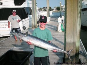 Jimmy Vass, Jr. (age 13) with his first wahoo. He hooked the fish on a ballyhoo under a blue/white sea witch in 50 fathoms of water off Wrightsville Beach while fishing with Les Edwards on the "Horse."