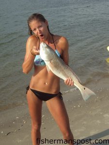 Kamaron Owens, from Richmond, VA, with a 26" red drum she hooked on a finger mullet while kayak fishing Lockwood Folly Inlet.