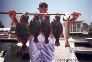 Jim Bartis, from Apex, with a stringer of flounder and a redfish caught near Southport using live peanut pogies. He was fishing with Capt. Greer Hughes of Cool Runnings Charters out of Oak Island.