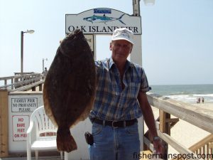 Cooper Triplett, of Lenoir, NC, with a 7.0 lb. flounder he hooked on a live finger mullet while fishing from Oak Island Pier.