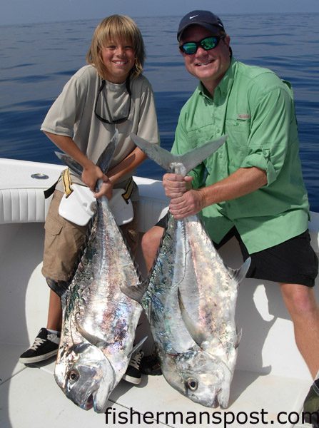 Logan (age 11) and Norm Adams, of Indian Trail, NC, with a pair of African pompano they hooked on live pogies near Frying Pan Tower while fishing with Capt. Arlen Ash of Ultimate Reaction Sportfishing out of Wrightsville Beach.