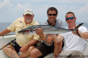 Capts. Andy and Adam Powell, of All In Charters, flank Fisherman's Post's Gary Hurley to show off a king mackerel that took an unhealthy interest in a cigar minnow at the BK Ledge.