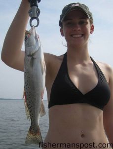 Sarah Aiken, from Raleigh, with a speckled trout that fell for a live shrimp in the lower Cape Fear River while she was fishing with Capt. Tommy Rickman of Southport Angler Outfitters.