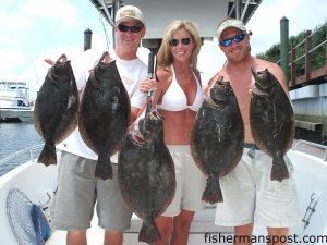 Scott and Meg Michaud, of Elizabethton, TN,  and Scott Blevins, of Southport, with 4-9 lb. flounder they hooked in the Cape Fear River near Southport.