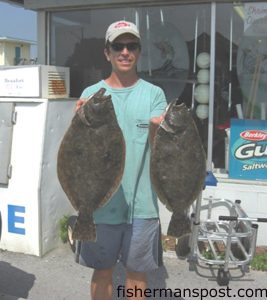 Chris Batsavage, of Morehead City, with a pair of flounder (the larger one 8 lbs., 4 oz.) he hooked inshore at Morehead City on live pinfish. Weighed in at Freeman's Bait and Tackle.