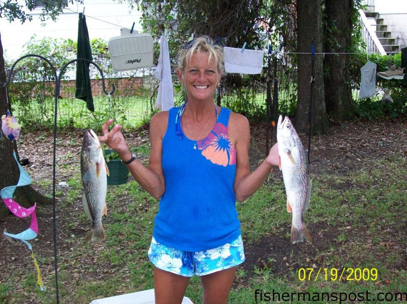 Leslie Whitford, of Morehead City, with a pair of gray trout she hooked in Beaufort Inlet on a spec rig tipped with shrimp. She was fishing with her husband Eddie.