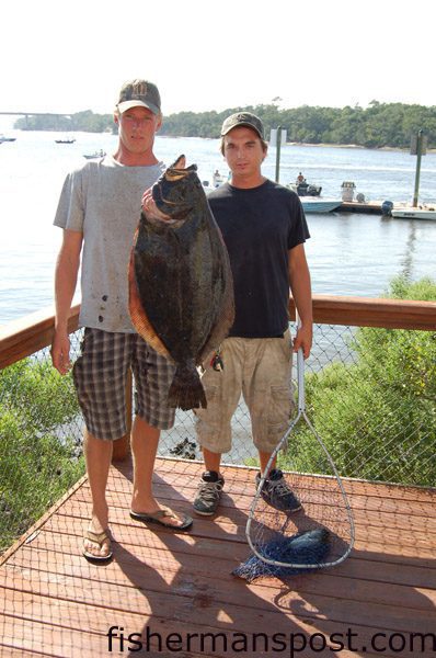 Chris Hanson and Troy Philip with the monster 12.28 lb. flounder that made up most of their 15.92 lb. winning two-fish aggregate in the Fisherman's Post NC Flatfish Championship. The big flatty fell for a live pogy on a jighead in the Cape Fear River.