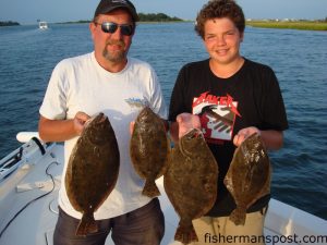 Dave and Adam Baker, from Raleigh, with a quartet of flounder (the larger fish 21") they hooked on live finger mullet while fishing the Cape Fear River with Capt. Russell Weaver of Living Waters Guide Service.