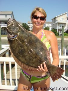 Jenn Parker, of Ocean Isle Beach, with a 9 lb. 10 oz. flounder caught on a live mud minnow. She was fishing on the “Island Girl.” Weighed at Ocean Isle Fishing Center.