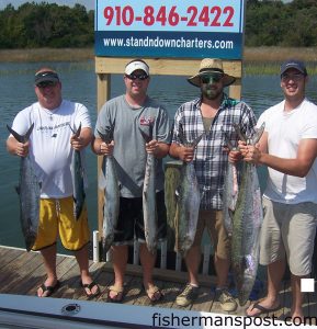 Justin Privette, Kevin Starnes, Claude Williamson, and Gene Mosely with king mackerel (the largest 28 lbs.) and a large spanish mackerel they hooked while trolling live baits in 45' near the Cape Fear River Channel. They were fishing with Capt. Keith Logan of Stand'N Down Charters out of Holden Beach.