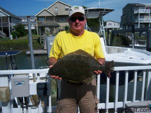 Atlas Warwick, of Lumberton/Sunset Beach, with a 6 lb., 14 oz. flounder that fell for a live finger mullet in the ICW near Ocean Isle.