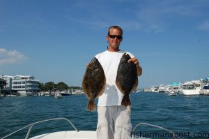 Wayne Crisco, of Last Resort Charters, with a pair of 2.5 lb. class flounder that fell for Carolina-rigged live finger mullet at various structure near Wrightsville Beach.