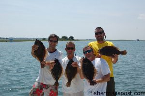 Gary Hurley, Capt. Wayne Crisco, Eddie Hardgrove, and Max Gaspeny with four 2.5-3 lb. flatfish that fell for live finger mullet on Carolina rigs around some Wrightsville Beach docks. 