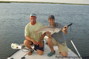 Capt. Jeff Wolfe, of Seahawk Inshore Charters, and Gary Hurley with 7+ lb., tournament-class red drum that fell for a live finger mullet on a jighead at an oyster point in the marsh near Bald Head Island.