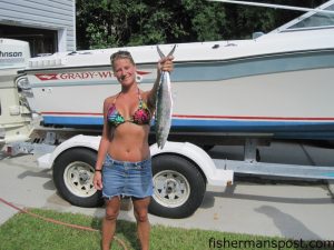 Brandy Beckdahl, of Wilmington, with a spanish mackerel she hooked on a light-lined dead pogy while fishing with Larry Oberti on the "Piece of Ship."