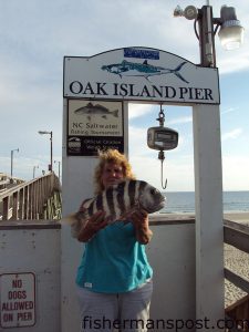 Roberta Grooves, of Oak Island, with a 6.8 lb. sheepshead she hooked on a live shrimp near the pilings of Oak Island Pier.