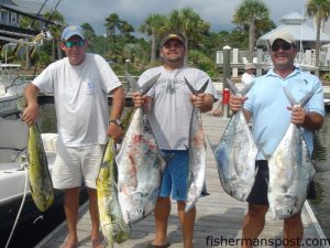 Tommy Rechichar, Tom Rechichar, and Steve Pierce with dolphin, African pompano, and a king mackerel they hooked near Frying Pan Tower on dead cigar minnows while fishing out of Southport on the "Seas the Moment."