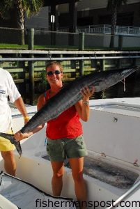 Michelle Evans, of Little River, SC, with a wahoo that fell for a red/black Ilander atop a ballyhoo in 100' of water inshore of the Mac Marlen Ledge while she was fishing aboard "The Law."