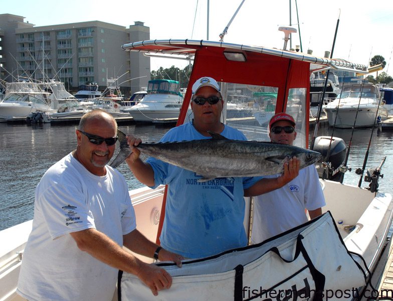 Jeff Lee, James Roberts, and Roger Gales, with the 35.60 lb. king that earned Shallotte's "King Hunter" fishing team $22,895 and the win in the 2009 Rumble in the Jungle. Their king fell for a live bluefish near the old Cape Fear sea buoy.