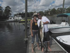 Wendy Delcotto and Nick Ferriell, of Tamarac, FL, with a 46” cobia that fell for a live, light-lined pogy while they were bottom fishing a few miles off Masonboro Inlet with Tony Del.  