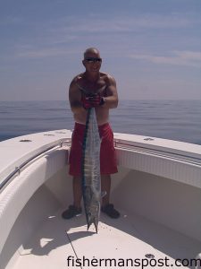 Mark Jones, of Wilmington, with a 30 lb. wahoo that fell for a ballyhoo under a Blue Water Candy Bling skirt in the Gulf Stream.