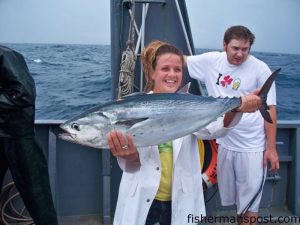 Kristin Fountain with a big flase albacore she hooked on a pink/white sea witch 25 miles off the Cape Fear River mouth while aboard the research vessel "Dan Moore."