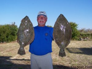 Terry Sossamon, of Holden Beach, with a big pair of flounder he hooked in Lockwood Folly Inlet on live finger mullet.