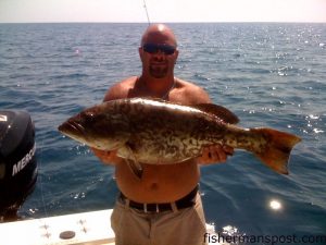 Mike LaVecchia, of Jacksonville, with a 15 lb. gag grouper caught 10 miles off New River Inlet on a diamond jig while he was fishing on the "Reel MCS."