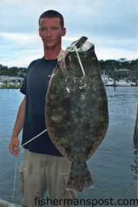 Mark Benson with a 9.4 lb. flounder he hooked on a live finger mullet under the Wrightsville drawbridge.