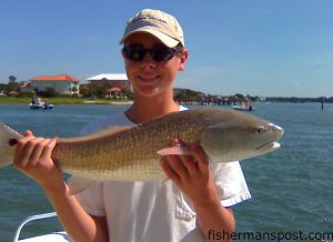 Cameron Maund, of Greenville, SC, with a fat red drum he hooked on a live finger mullet in the ICW near Ocean Isle while fishing with Atlas Warwick.