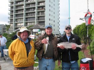 John Branch, Steve Woodard, and Scott Woodard with the red drum and trout that propelled them to victory and earned them a new Pro Series Power Pole in the 2009 CCA Inside/Out Tournament.