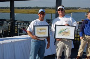 Capt. Ricky Kellum, of Speckled Specialist Charters, and Jason Crowder with the awards for most trout and Individual Grand Champion in the 2009 Cape Fear Red Trout Celebrity Classic.