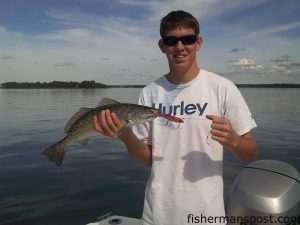 Jonathan Watson, of Swansboro, NC, with his first speckled trout. The fish fell for a MirrOlure in the White Oak River.