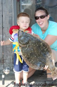 Owen Parker with a 9 lb., 6 oz. flounder that fell for a live finger mullet at a Wrightsville Beach dock.