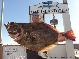 Kenny Prevatte, of Oak Island, with a 9 lb., 1 oz. flounder he hooked in the lower Cape Fear River on a live finger mullet. Weighed in at Oak Island Pier.