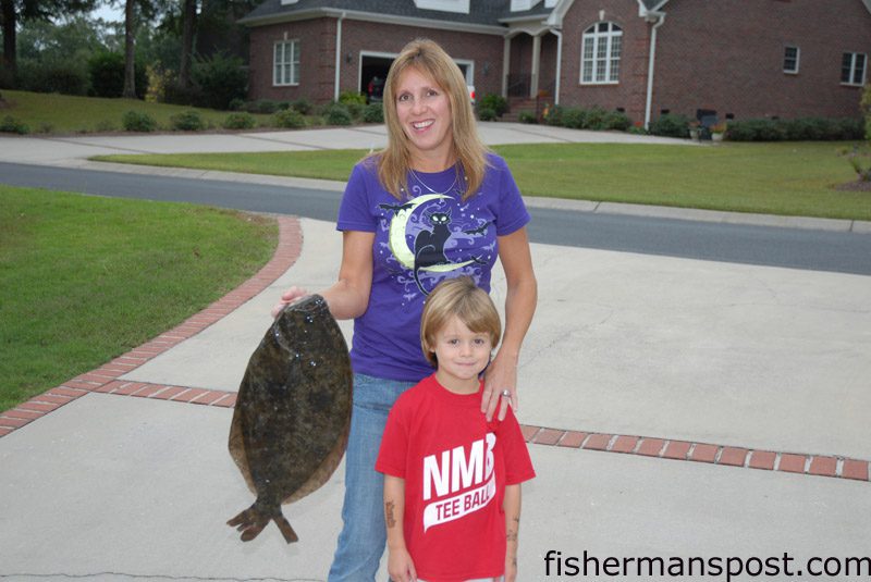 Lisa and Chance Hall, of Little River, SC, with a 5.9 lb. flounder Lisa hooked at the Sunset Beach Bridge on a live pogy.