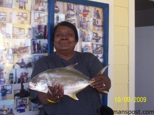 Linda Wall, of Rockingham, NC, with a 2 lb., 8 oz. pompano she hooked off Cherry Grove Pier on shrimp.