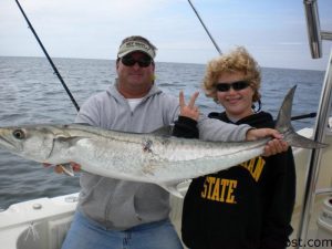 Capt. Jeff Williamson and Russ Gore with a 20 lb. king mackerel they hooked while live-baiting off Ocean Isle Beach.