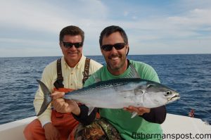 Capt. Tim Barefoot (left), of Barefoot Fishing, and Gary Hurley, of Fisherman's Post Newspaper, with a bonito caught on a ballyhoo rigged with Barefoot Fishing's new Chin Weight. They were fishing 80' of water about 20 miles out of Masonboro Inlet.