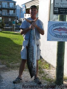 John Ballou, of Morehead City, with a 47 lb. king mackerel he hooked on the east side of Lookout Shoals on a live pogy. Weighed in at Chasin' Tails Outdoors.