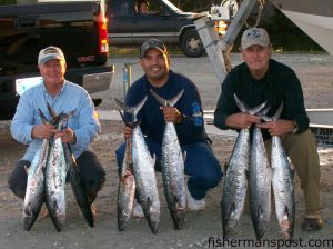 Ronnie Barnett, Ross Deleon, and Chuck Johnson with a limit of king mackerel they hooked while trolling dead baits at Christmas Rock. Photo courtesy of East Coast Sports.