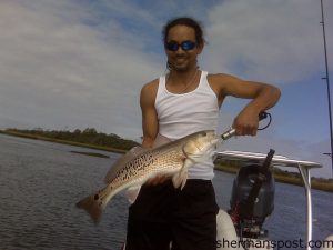 J.R. Pena, from Wilmington, with a heavily spotted red drum he hooked on a Halo shrimp in the Cape Fear River while fishing with Capt. Mark Armstrong.