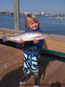 Luke Dudley (age 4), with his first speckled trout. It fell for a live shrimp at the Masonboro Jetties while he was fishing with his father.