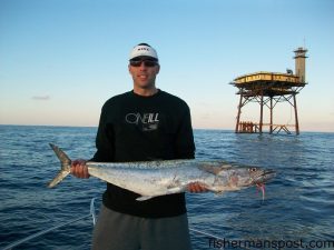 Randy Jones with his first king mackerel. He hooked the 22 lb. king on a cigar minnow 25' deep on the downrigger while fishing near Frying Pan Tower with Philip and Frank Roesel on the "Fowl Hooked."
