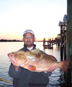 Capt. Keith Logan, of Stand'N Down Charters out of Holden Beach, with a red grouper hooked in 90' of water off of Frying Pan Shoals.